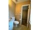 Bathroom featuring a toilet, a towel rack, and a doorway to the bedroom at 3715 Leisure Ln, College Park, GA 30349