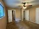 Bedroom with an open doorway to the bathroom, and a classic ceiling fan at 3715 Leisure Ln, College Park, GA 30349