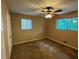 Cozy bedroom with neutral walls, carpet floors, and natural light from windows at 3715 Leisure Ln, College Park, GA 30349