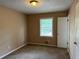 Bedroom featuring one window, neutral walls, carpet floor, and a closet at 3715 Leisure Ln, College Park, GA 30349