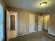 Bedroom featuring many doorways, neutral walls, carpet floor, and a window at 3715 Leisure Ln, College Park, GA 30349