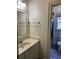 This bright bathroom features a modern vanity with a mirror, and a view of the toilet and shower at 3450 Camellia Ln, Suwanee, GA 30024