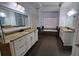 Elegant bathroom with granite countertops, double vanity, a bathtub, and tile floors at 3450 Camellia Ln, Suwanee, GA 30024