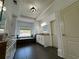 Luxurious bathroom with a soaking tub, vanity, and elegant black tile accents at 3450 Camellia Ln, Suwanee, GA 30024