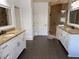Elegant bathroom featuring dual vanities and a spacious glass door shower at 3450 Camellia Ln, Suwanee, GA 30024
