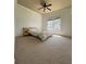 Cozy bedroom showcases plush carpet, a ceiling fan, and a sunlit window with neighborhood views at 3450 Camellia Ln, Suwanee, GA 30024