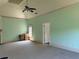 Large bedroom with high ceilings, neutral green walls, and a ceiling fan at 3450 Camellia Ln, Suwanee, GA 30024
