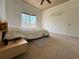 Inviting bedroom features plush carpet, a sunny window, and convenient bedside table with lamp at 3450 Camellia Ln, Suwanee, GA 30024
