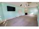 This primary bedroom offers cozy carpeted floors, a fireplace, and a ceiling fan at 3450 Camellia Ln, Suwanee, GA 30024