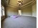 Bright bedroom with plush carpet, a tray ceiling, and a large window for ample natural light at 3450 Camellia Ln, Suwanee, GA 30024