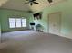 Airy bedroom featuring a window, ceiling fan, and neutral walls for a serene space at 3450 Camellia Ln, Suwanee, GA 30024