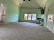 Bright bedroom with a tray ceiling, neutral walls, and an expansive carpeted floor at 3450 Camellia Ln, Suwanee, GA 30024