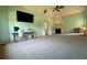Spacious bedroom featuring a ceiling fan, fireplace, and a large window for ample natural light at 3450 Camellia Ln, Suwanee, GA 30024