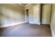 Neutral bedroom featuring plush carpeting, white trim, and two doors, offering comfort and accessibility at 3450 Camellia Ln, Suwanee, GA 30024
