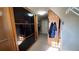 A large walk-in closet with built in shelves and hanging racks for clothing at 3450 Camellia Ln, Suwanee, GA 30024
