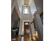 Chandelier over the foyer and hardwood floors. Large window provides great natural light at 3450 Camellia Ln, Suwanee, GA 30024