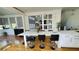 Bright kitchen featuring an oversized island with breakfast bar and seamless transition to other rooms at 3450 Camellia Ln, Suwanee, GA 30024