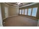 Expansive main bedroom with tray ceilings, multiple windows, and neutral colors, offering an open and airy feel at 3450 Camellia Ln, Suwanee, GA 30024