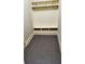 Mudroom complete with built in bench, shelving and tile floors at 3450 Camellia Ln, Suwanee, GA 30024