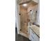 Tiled standalone shower with glass door and granite countertop in a Primary bathroom at 3450 Camellia Ln, Suwanee, GA 30024