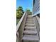 Wooden staircase leading up to a deck or patio area at 3450 Camellia Ln, Suwanee, GA 30024