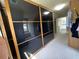 Bright walk-in closet features dark-framed closets and an entry into an ensuite bathroom at 3450 Camellia Ln, Suwanee, GA 30024