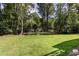 Lush backyard with bridge crossing a stream at 1377 Oak Grove Dr, Decatur, GA 30033