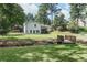 Wide shot of back of home and backyard with bridge feature at 1377 Oak Grove Dr, Decatur, GA 30033