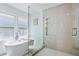 Elegant bathroom with a soaking tub, a glass-enclosed shower, and a modern design at 1377 Oak Grove Dr, Decatur, GA 30033