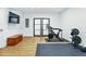 Home gym featuring modern equipment, hardwood floors, and lots of space at 1377 Oak Grove Dr, Decatur, GA 30033