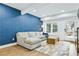 Cozy living room with a stylish blue accent wall, comfortable seating, and lots of natural light at 1377 Oak Grove Dr, Decatur, GA 30033