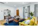 Sunlit living room featuring hardwood floors, stylish furniture, large windows and modern décor at 1377 Oak Grove Dr, Decatur, GA 30033