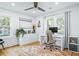 Bright home office with hardwood floors, a large window, and a modern desk setup at 1377 Oak Grove Dr, Decatur, GA 30033