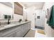 Spa-like bathroom with double vanity and walk-in shower at 648 Glendale Rd, Scottdale, GA 30079