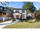 Charming two-story house with a modern exterior and manicured lawn at 648 Glendale Rd, Scottdale, GA 30079