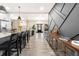 Modern kitchen with island seating and a view into the entryway at 648 Glendale Rd, Scottdale, GA 30079