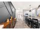 Modern kitchen with island seating and a view into the entryway at 648 Glendale Rd, Scottdale, GA 30079