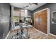 Modern home office with standing desk and built-in wood cabinetry at 648 Glendale Rd, Scottdale, GA 30079