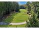 Property with wooded area and golf course views at 5040 Harrington Rd, Johns Creek, GA 30022