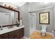 Basement bathroom with a shower/tub combo and updated vanity at 5040 Harrington Rd, Johns Creek, GA 30022