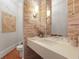 Modern bathroom with floating vanity and stone wall at 5040 Harrington Rd, Johns Creek, GA 30022