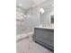 Bathroom with marble shower and gray vanity at 5040 Harrington Rd, Johns Creek, GA 30022