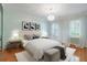 Bedroom with light walls and wood floors at 5040 Harrington Rd, Johns Creek, GA 30022