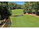 Aerial view of a green golf course at 5040 Harrington Rd, Johns Creek, GA 30022