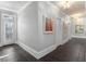 Bright hallway with tile floors and artwork at 5040 Harrington Rd, Johns Creek, GA 30022