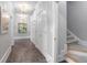 Elegant hallway with storage and staircase at 5040 Harrington Rd, Johns Creek, GA 30022