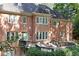 Brick house with large deck and wooded backyard at 5040 Harrington Rd, Johns Creek, GA 30022