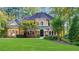 Two-story house with manicured lawn at 5040 Harrington Rd, Johns Creek, GA 30022