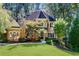 Brick home with lush landscaping at 5040 Harrington Rd, Johns Creek, GA 30022