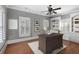 Home office with built-in bookcases and hardwood floors at 5040 Harrington Rd, Johns Creek, GA 30022